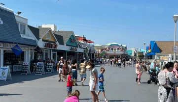 Colorful boardwalk shops at Jenkinson’s in Point Pleasant Beach offering gifts, beachwear, and treats